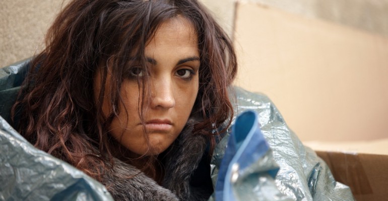 portrait of young poor woman in cold weather